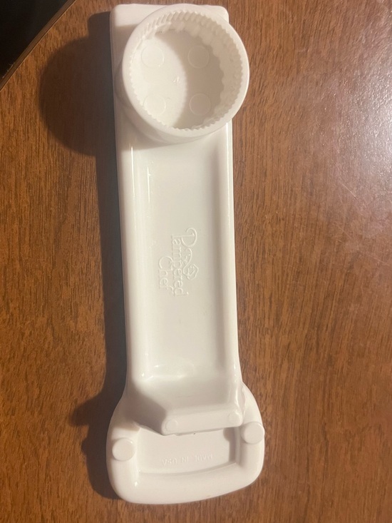 Pampered Chef Other - Pampered Chef White Plastic bottle  opener .